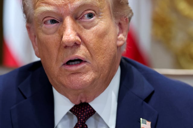 U.S. President Donald Trump attends a cabinet meeting at the White House in Washington, D.C., U.S., August 26, 2025. REUTERS/Jonathan Ernst