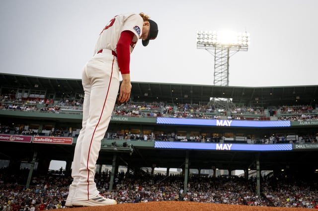 Dustin May #85 of the Boston Red Sox warms up on the mound before making his Red Sox debut against the Kansas City Royals on August 6, 2025 at Fenway Park in Boston, Massachusetts.