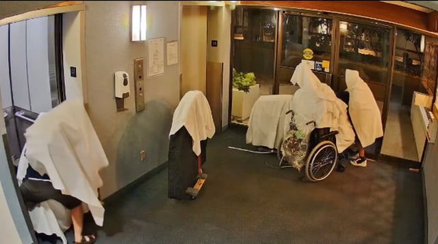 Two suspects try to conceal themselves during an overnight theft of audio equipment from a seniors' care community in New Westminster, B.C. on August 9, 2025 in this police handout image taken from surveillance video. THE CANADIAN PRESS/Handout - New Westminster Police (Mandatory Credit)