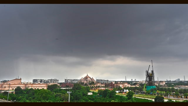 Dark clouds seen over Akshardham Temple on Tuesday afternoon. (Sanjeev Verma/HT Photo)