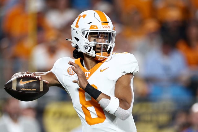 Nico Iamaleava #8 of the Tennessee Volunteers attempts a pass during the first half of the Duke's Mayo Classic against the NC State Wolfpack at Bank of America Stadium on September 07, 2024 in Charlotte, North Carolina.