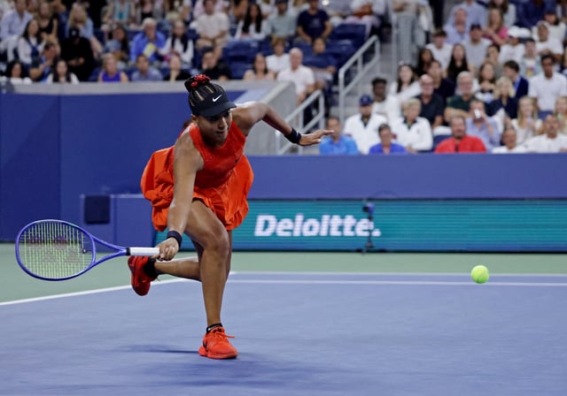 Tennis - U.S. Open - Flushing Meadows, New York, United States - August 26, 2025 Japan's Naomi Osaka in action during her first round match against Belgium's Greet Minnen REUTERS/Jeenah Moon