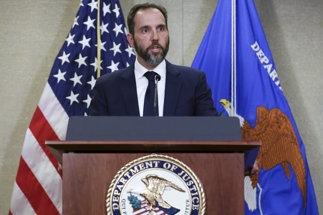 Special Counsel Jack Smith can be seen delivering remarks on an unsealed indictment including four felony counts against former U.S. President Donald Trump at the Justice Department on August 1, 2023, in Washington, D.C. (Photo by Alex Wong/Getty Images)