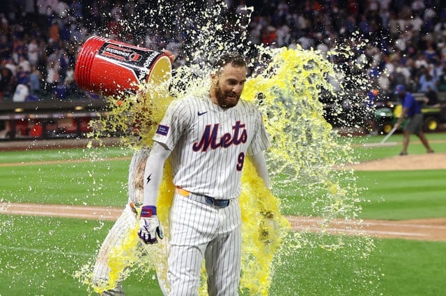 New York Mets' Pete Alonso, left, celebrates with Brandon Nimmo, right, after a walk-off win during the ninth inning of a baseball game against the Philadelphia Phillies, Tuesday, Aug. 26, 2025, in New York. (AP Photo/Pamela Smith)