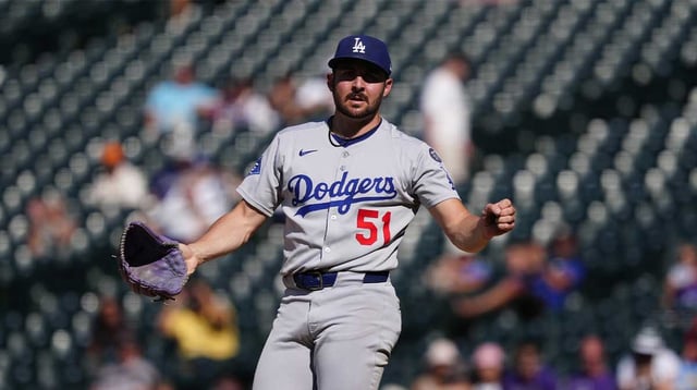 Aug 21, 2025; Denver, Colorado, USA; Los Angeles Dodgers relief pitcher Alex Vesia (51) reacts to the final out of the ninth inning against the Colorado Rockies at Coors Field. Mandatory Credit: Ron Chenoy-Imagn Images
