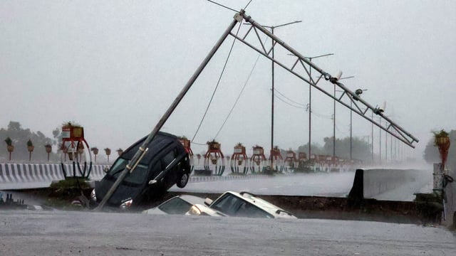 Vehicles plunge as a portion of the Fourth Tawi Bridge collapses at Bhagwati Nagar in Jammu on Tuesday.