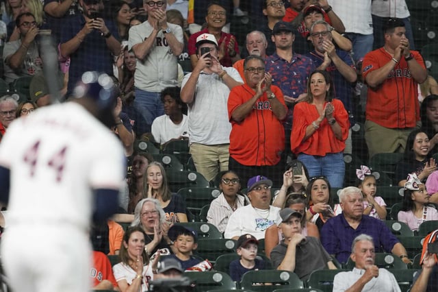 Houston Astros fans cheer as Yordan Alvarez is seen at his first atbat during the first inning of an MLB baseball game in Houston, Tuesday, Aug. 26, 2025.