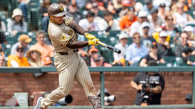 Aug 13, 2025; San Francisco, California, USA; San Diego Padres outfielder Ramon Laureano (5) hits a 2-run home run during the fifth inning against the San Francisco Giants at Oracle Park. Mandatory Credit: Bob Kupbens-Imagn Images.