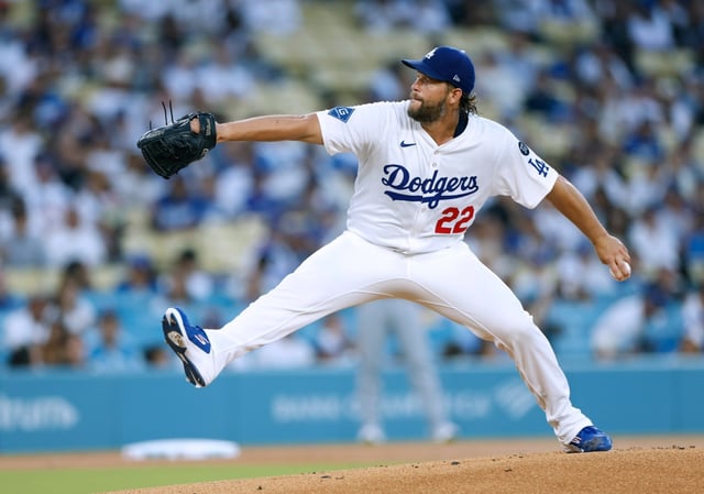 Dodgers starting pitcher Clayton Kershaw throws to the plate during the first inning of their game against the Cincinnati Reds on Tuesday night at Dodger Stadium. (Photo by Harry How/Getty Images)