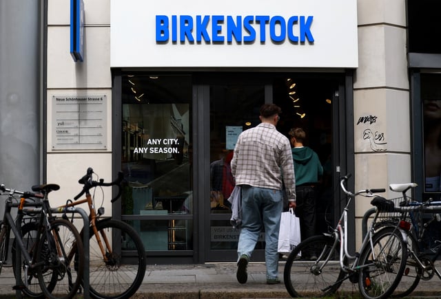 People enter a Birkenstock shoe shop in Berlin, Germany, April 8, 2025. REUTERS/Lisi Niesner/ File Photo