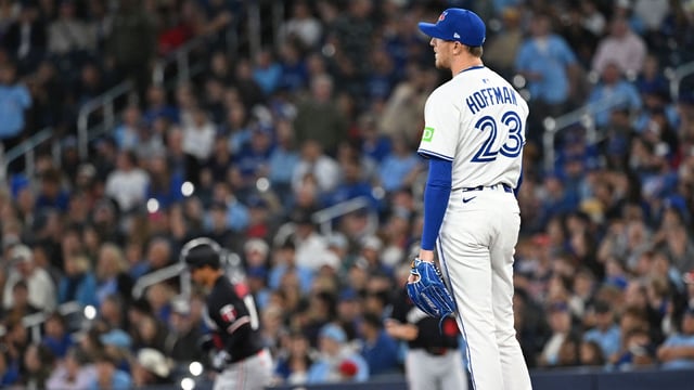 Aug 26, 2025; Toronto, Ontario, CAN; Toronto Blue Jays relief pitcher Jeff Hoffman (23) watches Minnesota Twins catcher Mickey Gasper (11) round the bases after hitting a solo home run in the ninth inning at Rogers Centre. Mandatory Credit: Dan Hamilton-Imagn Images