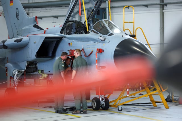 Members of the military work on PA-200 Tornado combat aircraft at an air base of German army Bundeswehr, in Buechel, Germany, July 18, 2024. REUTERS/Thilo Schmuelgen/File Photo