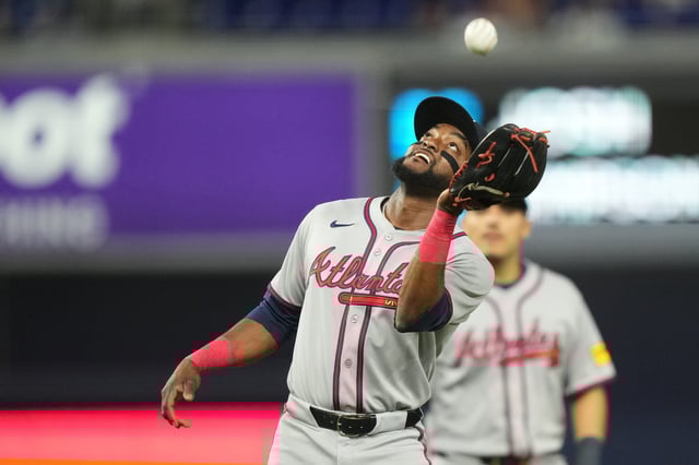 Aug 25, 2025; Miami, Florida, USA;  Atlanta Braves third baseman Vidal Brujan (17) catches an infield pop-fly against the Miami Marlins to end the eighth inning at loanDepot Park. Mandatory Credit: Jim Rassol-Imagn Images