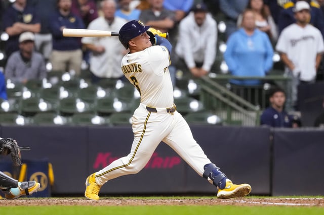 Aug 26, 2025; Milwaukee, Wisconsin, USA;  Milwaukee Brewers left fielder Isaac Collins (6) drives in the winning run with a sacrifice  fly ball during the ninth inning against the Arizona Diamondbacks at American Family Field. Mandatory Credit: Jeff Hanisch-Imagn Images