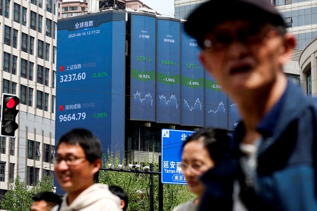  An electronic board shows Shanghai and Shenzhen stock indices in Shanghai, China April 16, 2025. REUTERS/Go Nakamura/ File Photo