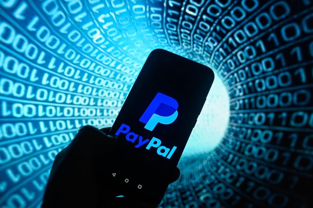February 24, 2025, Poland: In this photo illustration, a Paypal logo is displayed on a smartphone with binary code on the background. (Credit Image: © Omar Marques/SOPA Images via ZUMA Press Wire