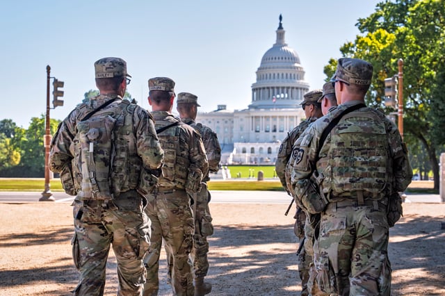 Armed National Guard soldiers from West Virginia patrol the Mall near the Capitol in Washington, as part of President Donald Trump's order to impose federal law enforcement in the District of Columbia, Tuesday, Aug. 26, 2025. (AP Photo/J. Scott Applewhite)