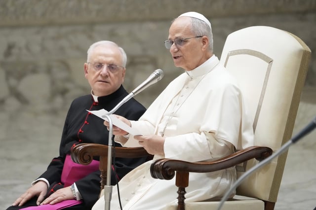 Pope Leo XIV reads his message during the weekly general audience at the Vatican, Wednesday, Aug. 27, 2025. (AP Photo/Gregorio Borgia)
