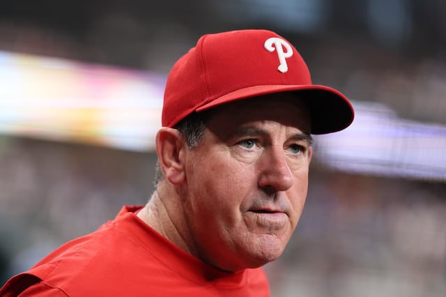 ARLINGTON, TEXAS - AUGUST 08: Manager Rob Thomson #49 of the Philadelphia Phillies looks on prior to the game against the Texas Rangers at Globe Life Field on August 08, 2025 in Arlington, Texas. (Photo by Sam Hodde/Getty Images)