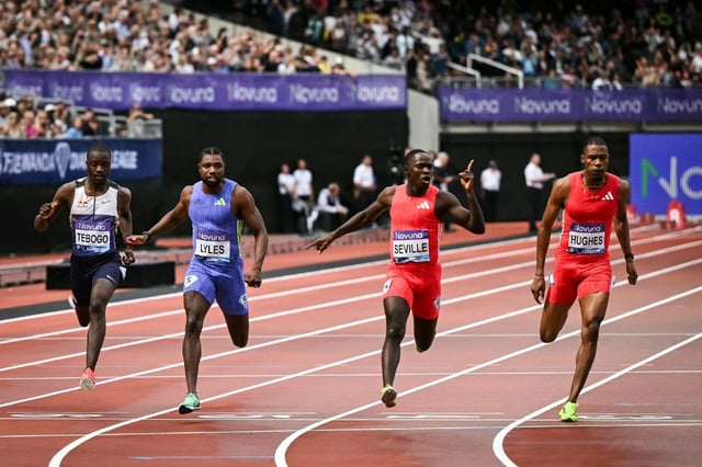 Jamaica's Oblique Seville (2nd R), celebrates as he denies Noah Lyles (2nd L), at the London Diamond League