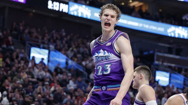 Feb 23, 2023; Salt Lake City, Utah, USA; Utah Jazz forward Lauri Markkanen (23) reacts to dunking the ball during the second half against the Oklahoma City Thunder at Vivint Arena. Mandatory Credit: Chris Nicoll-Imagn Images