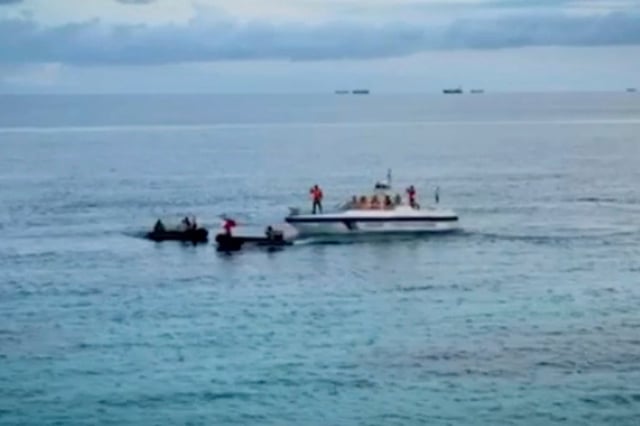 Two Philippine inflatables block the attempt of a Chinese Coastguard small boat to go near the long-grounded Philippine warship BRP Sierra Madre on August 20. Photo: Armed Forces of the Philippines/AP