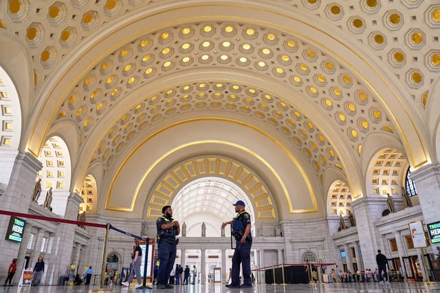 Amtrak Police officers patrol Union Station, Tuesday, Aug. 26, 2025, in Washington. (AP Photo/Mariam Zuhaib)