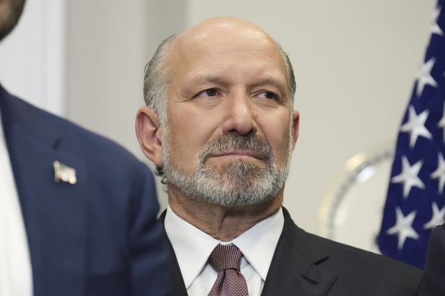 Commerce Secretary Howard Lutnick listens as President Donald Trump speaks during an event to sign an executive order restarting the Presidential Fitness Test in public schools, Thursday, July 31, 2025, in the Roosevelt Room of the White House in Washington.
