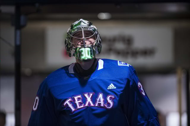 Jan 19, 2019; Dallas, TX, USA; Dallas Stars goaltender Ben Bishop (30) skates in Texas Rangers baseball club hockey jerseys before the game against the Winnipeg Jets at the American Airlines Center. Mandatory Credit: Jerome Miron-USA TODAY Sports