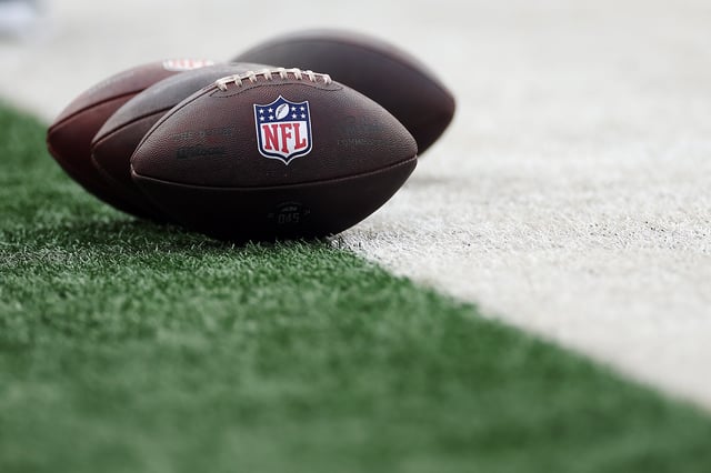 EAST RUTHERFORD, NEW JERSEY - AUGUST 16: Detail of Wilson footballs with the NFL logo before the first half of the NFL Preseason 2025 game between New York Jets and New York Giants at MetLife Stadium on August 16, 2025 in East Rutherford, New Jersey. (Photo by Sarah Stier/Getty Images)