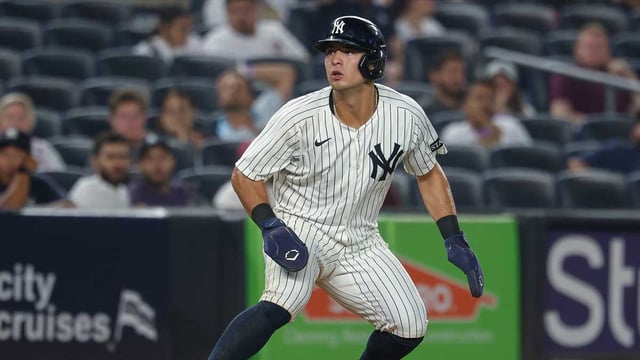 Aug 13, 2025; Bronx, New York, USA; New York Yankees shortstop Anthony Volpe (11) takes a lead during the seventh inning against the Minnesota Twins at Yankee Stadium. Mandatory Credit: Vincent Carchietta-Imagn Images