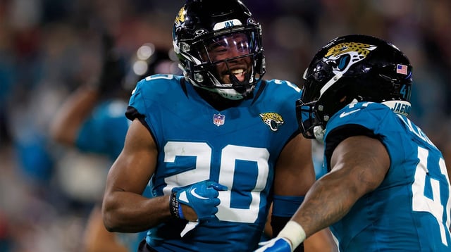 Jacksonville Jaguars safety Daniel Thomas (20) celebrates his open field tackle on a kickoff return with teammate linebacker Josh Allen (41) during the third quarter of a regular season NFL football matchup Sunday, Dec. 17, 2023 at EverBank Stadium in Jacksonville, Fla. The Baltimore Ravens defeated the Jacksonville Jaguars 23-7. Corey Perrine/Florida Times-Union / USA TODAY NETWORK