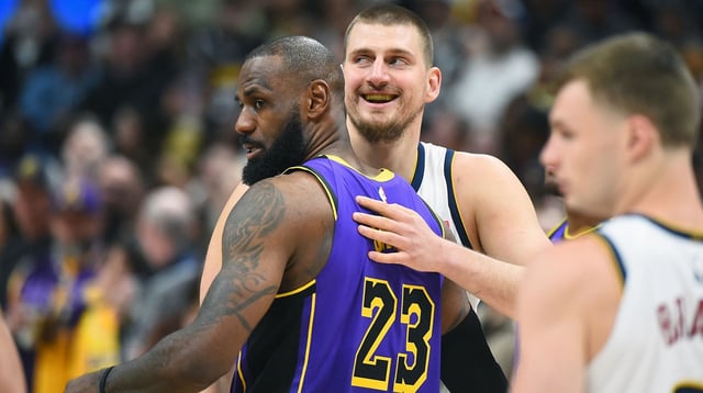 Feb 22, 2025; Denver, Colorado, USA; Denver Nuggets center Nikola Jokic (15) and Los Angeles Lakers forward LeBron James (23) hug before the game at Ball Arena. Mandatory Credit: Christopher Hanewinckel-Imagn Images