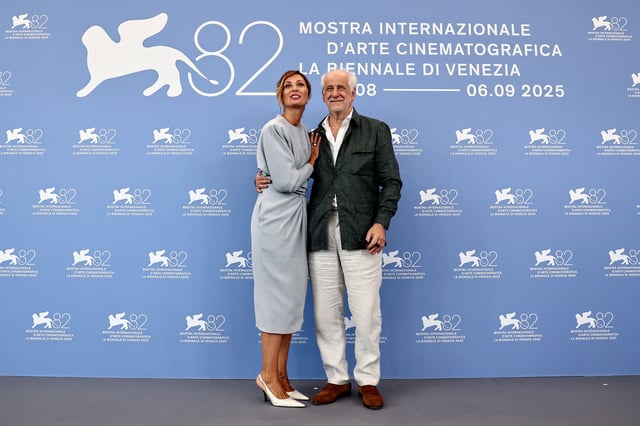 Cast members Anna Ferzetti and Toni Servillo pose during a photocall for the movie "La Grazia", in competition, on the opening day of the 82nd Venice Film Festival, in Venice, Italy, August 27, 2025. REUTERS/Yara Nardi