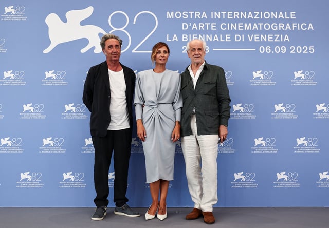 Director Paolo Sorrentino and cast members Anna Ferzetti and Toni Servillo pose during a photocall for the movie "La Grazia", in competition, on the opening day of the 82nd Venice Film Festival, in Venice, Italy, August 27, 2025. REUTERS/Yara Nardi