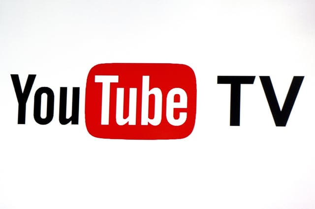 FILE - YouTube TV logo is seen at the YouTube Space LA in Los Angeles, Feb. 28, 2017. (AP Photo/Reed Saxon, File)