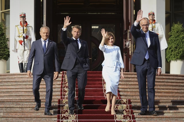 From left, Polish Prime Minister Donald TUsk, French President Emmanuel Macron, Moldova's President Maia Sandu and German Chancellor Friedrich Merz leave the country's presidency headquarters in Chisinau, Moldova, Wednesday, Aug. 27, 2025. (AP Photo/Aurel Obreja)