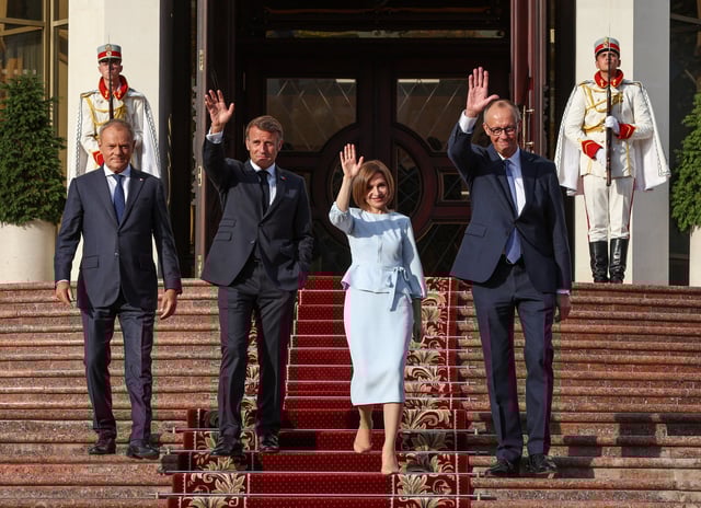 Poland's Prime Minister Donald Tusk, France's President Emmanuel Macron, Moldovan President Maia Sandu, and Germany's Chancellor Friedrich Merz walk after a meeting at the Presidential Palace in Chisinau, Moldova, August 27, 2025.  REUTERS/Vladislav Culiomza     TPX IMAGES OF THE DAY
