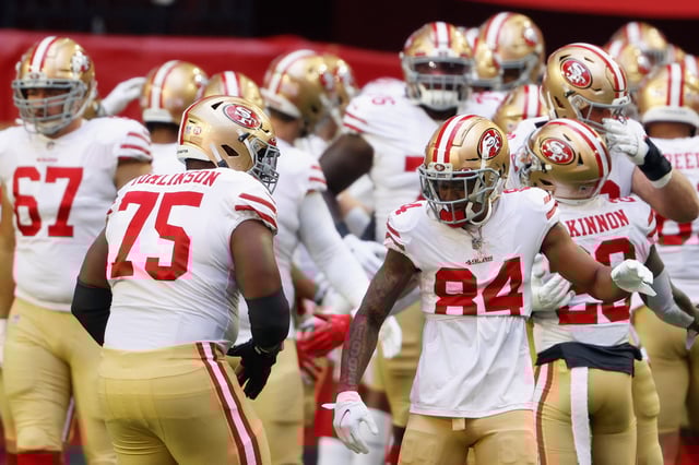 GLENDALE, ARIZONA - JANUARY 03: Wide receiver Kendrick Bourne #84 of the San Francisco 49ers high fives Laken Tomlinson #75 during warm-ups to the NFL game against the Seattle Seahawks at State Farm Stadium on January 03, 2021 in Glendale, Arizona.