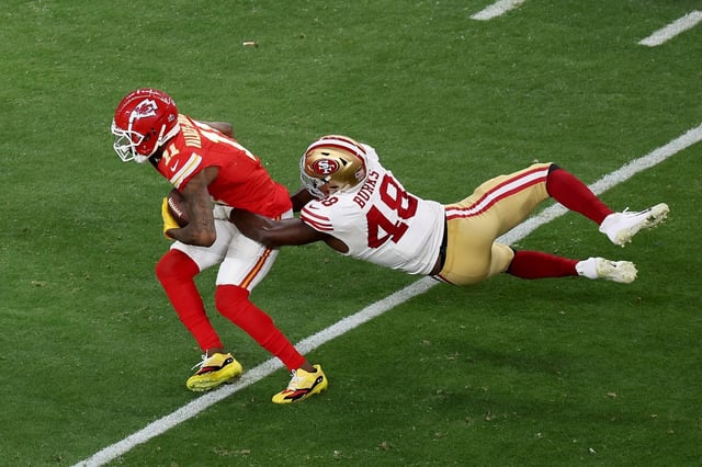 Kansas City Chiefs’ Marquez Valdes-Scantling (11) is tackled by San Francisco 49ers’ Oren Burks (48) during the Chief’s game-winning drive in Super Bowl 58 at Allegiant Stadium in Las Vegas, Nev., on Sunday, Feb. 11, 2024. (Karl Mondon/Bay Area News Group)