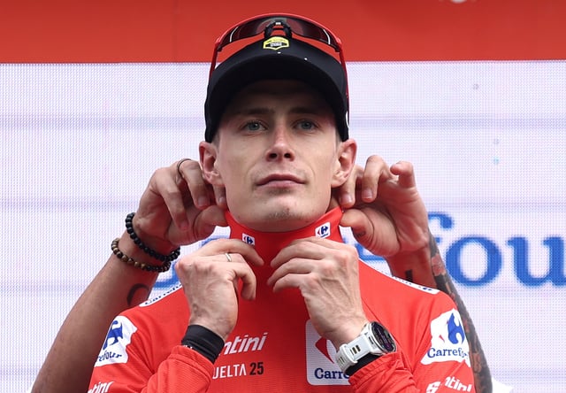 Cycling - Vuelta a Espana - Stage 3 - San Maurizio Canavese to Ceres - San Maurizio Canavese, Italy - August 25, 2025 Team Visma | Lease A Bike's Jonas Vingegaard on the podium wearing the red jersey after stage 3 REUTERS/Manon Cruz/File Photo