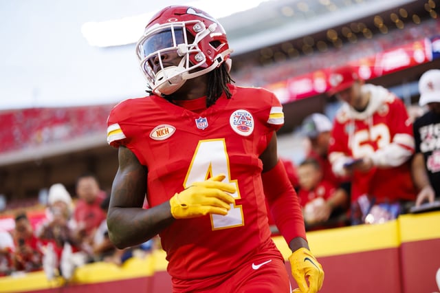 Rashee Rice #4 of the Kansas City Chiefs runs onto the field during pregame warmups prior to an NFL football game against the Denver Broncos at GEHA Field at Arrowhead Stadium on October 12, 2023 in Kansas City, Missouri.