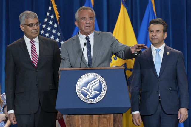 Health and Human Services Secretary Robert F. Kennedy Jr. flanked by Director of the National Institutes of Health Jay Bhattacharya, left, and Food and Drug Administration (FDA) Commissioner Marty Makary, right, speaks during a news conference on the FDA's intent to phase out the use of petroleum-based synthetic dyes in the nation's food supply at the Hubert Humphrey Building Auditorium in Washington, Tuesday, April 22, 2025.
