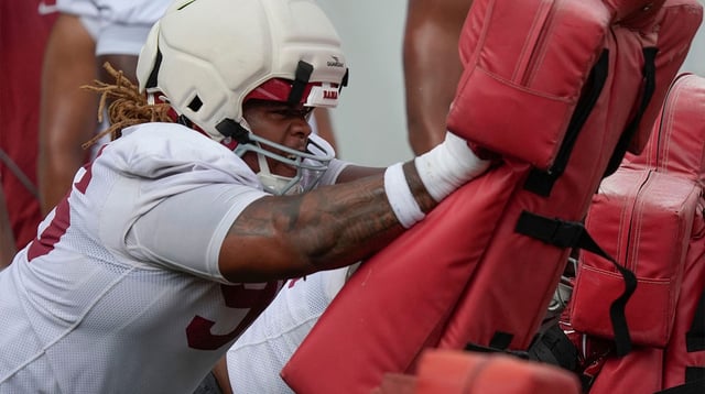 July 30, 2025; Tuscaloosa, AL, USA; Defensive lineman Tim Keenan III hit the sled during the first practice session of the preseason for the Alabama Crimson Tide.

Gary Cosby Jr. / USA TODAY NETWORK via Imagn Images