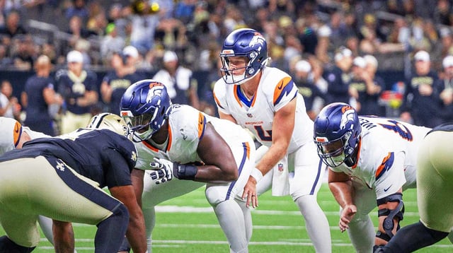 Aug 23, 2025; New Orleans, Louisiana, USA; Denver Broncos quarterback Sam Ehlinger (4) calls for he ball against the New Orleans Saints during the second half at Caesars Superdome. Mandatory Credit: Stephen Lew-Imagn Images