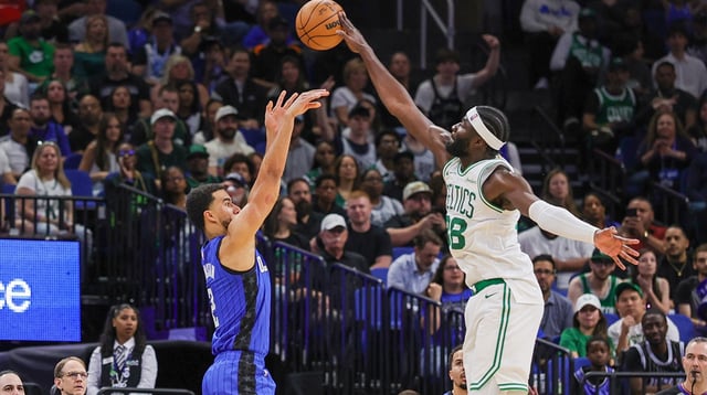 Apr 9, 2025; Orlando, Florida, USA; Boston Celtics center Neemias Queta (88) blocks a shot by Orlando Magic guard Caleb Houstan (2) during the second quarter at Kia Center. Mandatory Credit: Mike Watters-Imagn Images