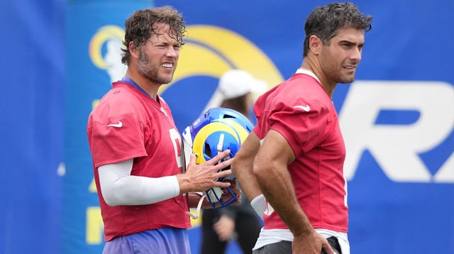 May 28, 2025; Woodland Hills, CA, USA; Los Angeles Rams quarterbacks Matt Stafford (9) and Jimmy Garroppolo (11) take a break during organized team activities at Rams Practice Facility. Mandatory Credit: Kirby Lee-Imagn Images
