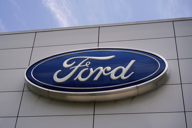 FILE - The Ford logo is seen above the entrance to the Ford Motor Company Kentucky Truck Plant, April 30, 2025, in Louisville, Ky. (AP Photo/Carolyn Kaster, File)