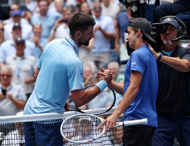 Tennis - U.S. Open - Flushing Meadows, New York, United States - August 27, 2025 Serbia's Novak Djokovic shakes hands with Zachary Svajda of the U.S. after winning his second round match REUTERS/Brendan Mcdermid
