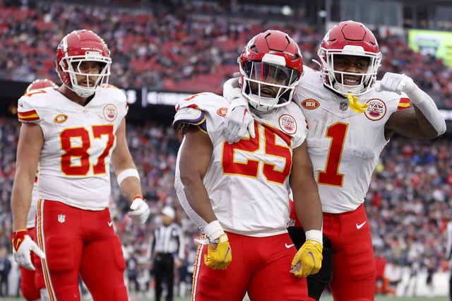 FOXBOROUGH, MASSACHUSETTS - DECEMBER 17: Travis Kelce #87, Clyde Edwards-Helaire #25 and Jerick McKinnon #1 of the Kansas City Chiefs celebrate after Edwards-Helaire's receiving touchdown during the third quarter against the New England Patriots at Gillette Stadium on December 17, 2023 in Foxborough, Massachusetts. (Photo by Sarah Stier/Getty Images)
